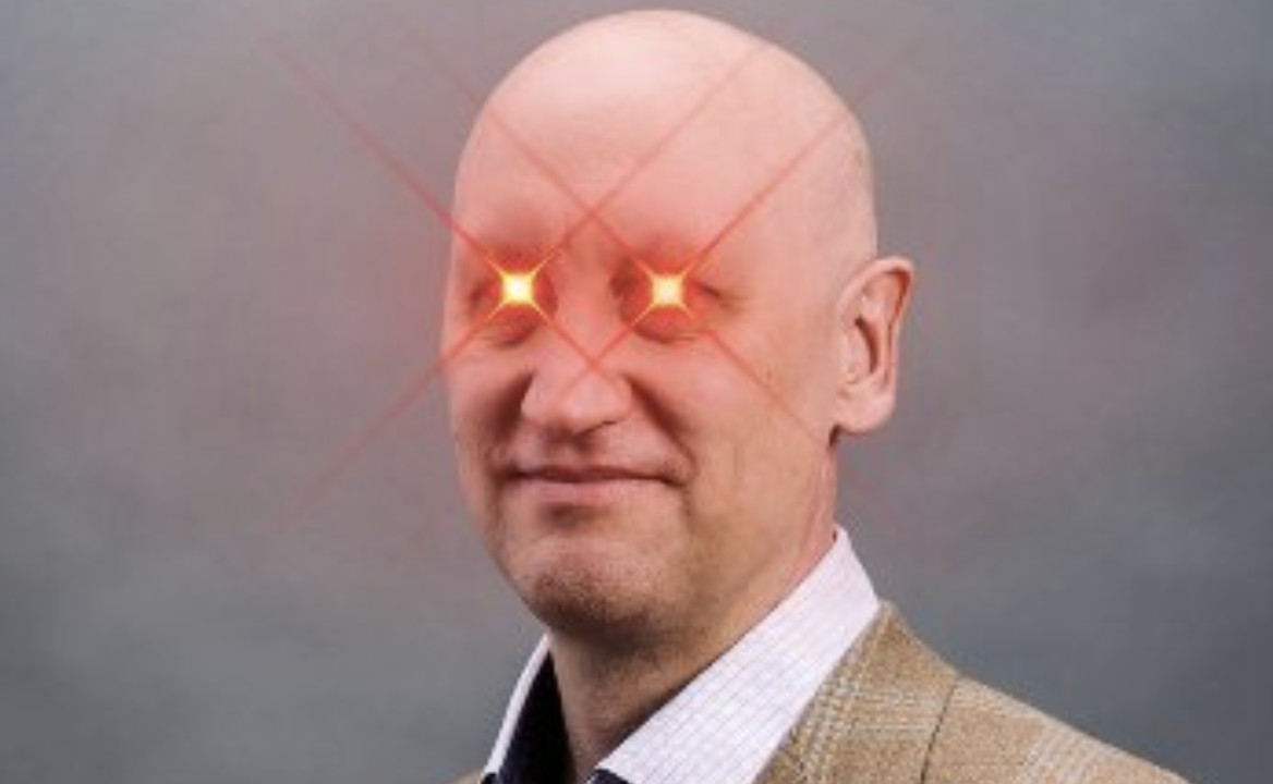 A photo of Stuart Hoegner with laser eyes.